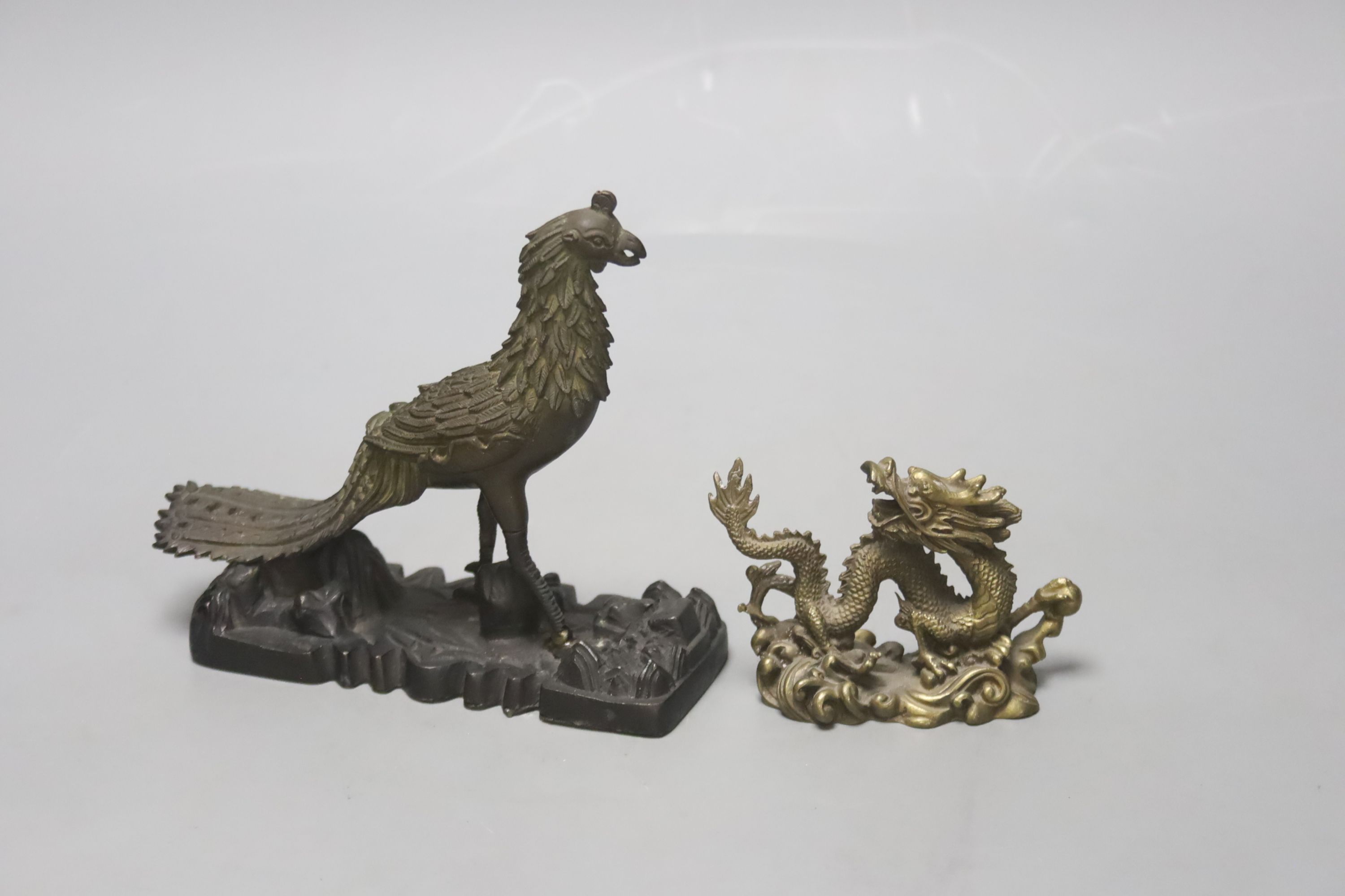 A 19th century Chinese bronze figure of a phoenix, repairs, and a 20th century Chinese bronze figure of a dragon, tallest 13.5cm